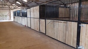 A large, open indoor space with high ceilings and wooden walls. - Glamping in Wiltshire the Green Knoll is a charm (Chippenham)