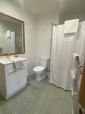 Shower, hair dryer, towels, soap
