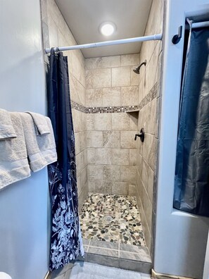 Shower, hair dryer, towels