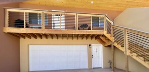 Sits over garage, must climb stairs