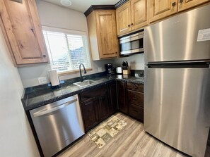 Fridge, microwave, stovetop, dishwasher - Moab Basecamp: Garage • Extra Parking • Dog-Friendly (Moab)