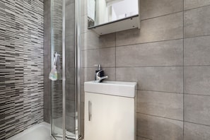 Shower, towels, soap, toilet paper