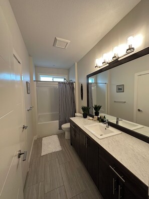 Combined shower/tub, hair dryer, towels, soap