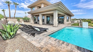 A modern house with a swimming pool, outdoor furniture, and palm trees. - Panoramic Mtn Views! Desert Home in Fountain Hills (Fountain Hills)