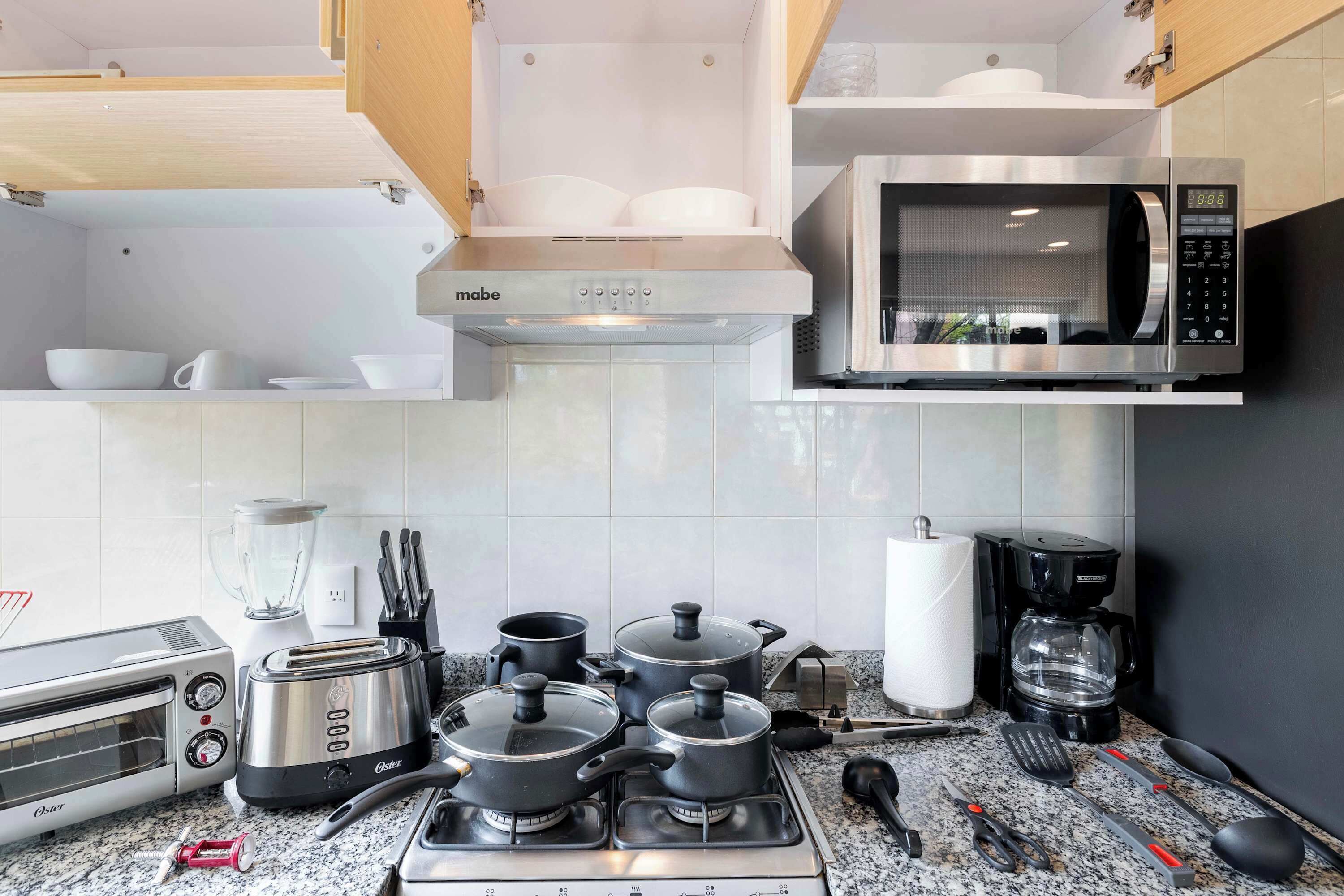 Coffee/tea maker, fridge, microwave, oven