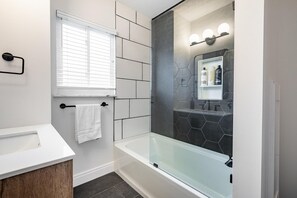 Bathtub, hair dryer, towels