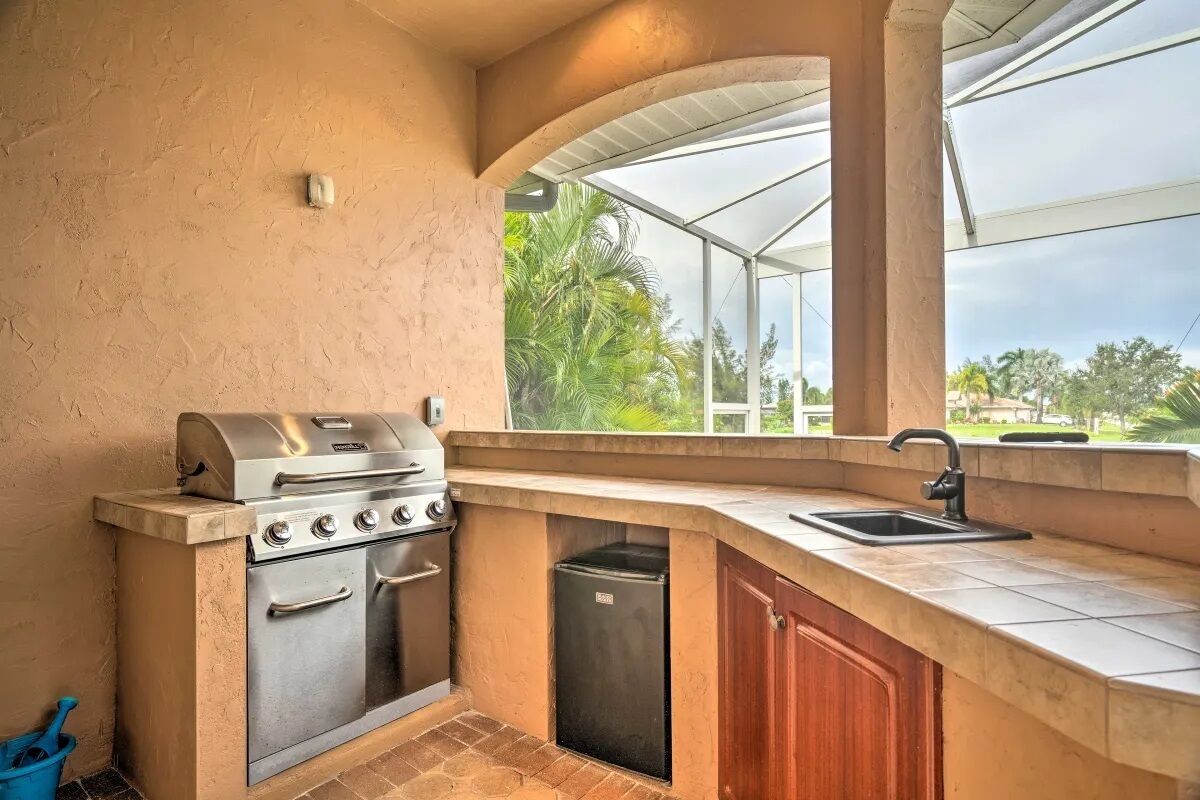 grill, fridge, sink.  outdoor cooking area or extra cold drink storage by pool!