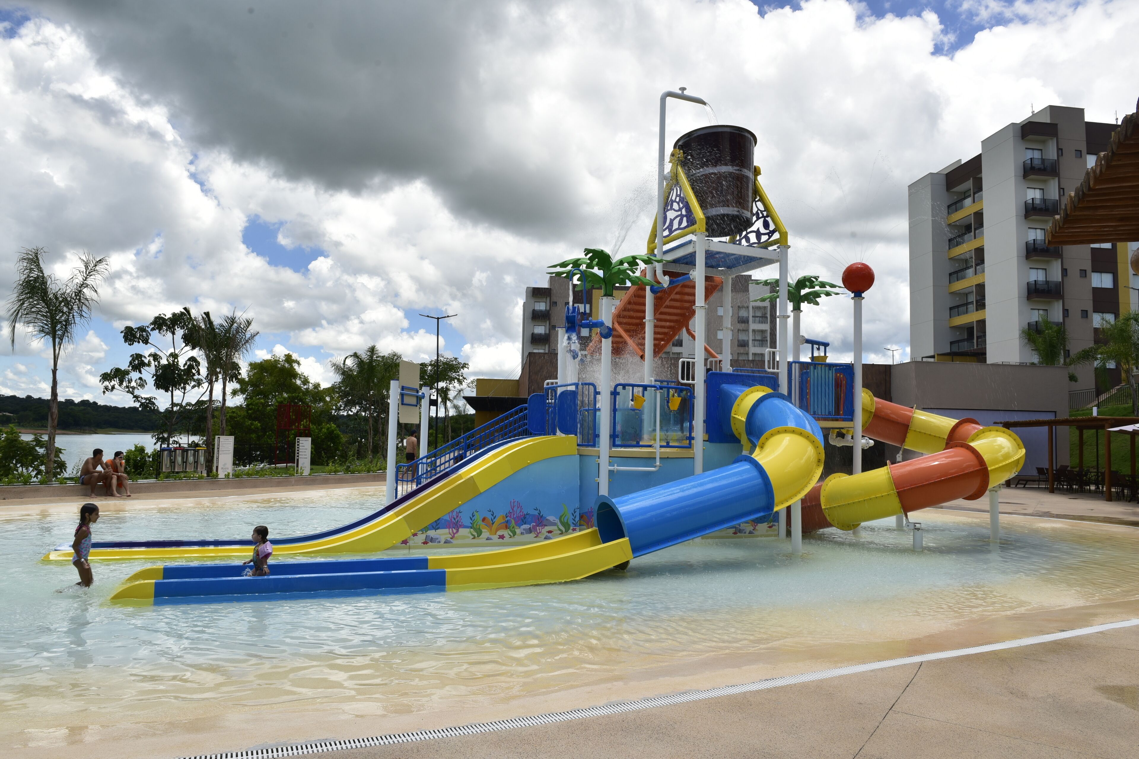 A water park with multiple slides and a water fountain.