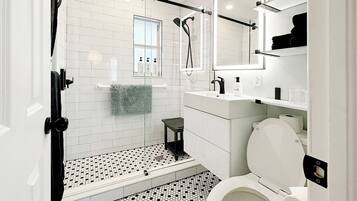Combined shower/tub, hair dryer, towels, soap