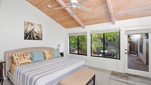 A bedroom with a bed, a bench, a ceiling fan, and a door leading to an outdoor area. - Red Rock Retreat • Golf • Hiking & Biking Trails • Views • Dining VOC •Adventure (Sedona)