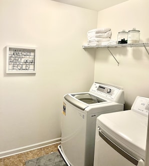 Convenient laundry facilities with a front-loading washer and dryer.