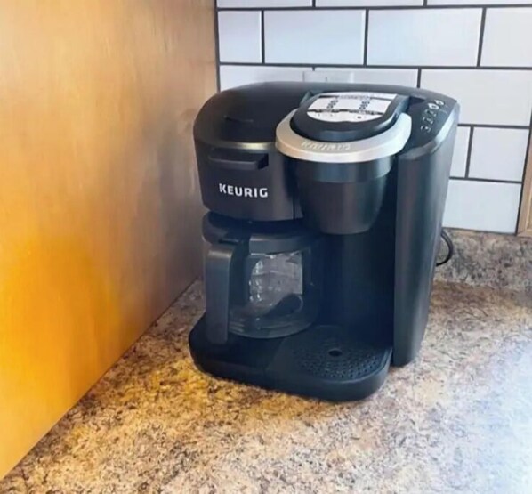 A Keurig coffee maker on a kitchen counter.