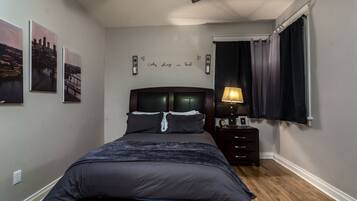 1 bedroom, desk, iron/ironing board, travel crib