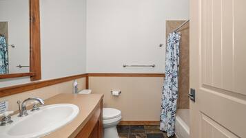 Combined shower/tub, hair dryer, towels, soap