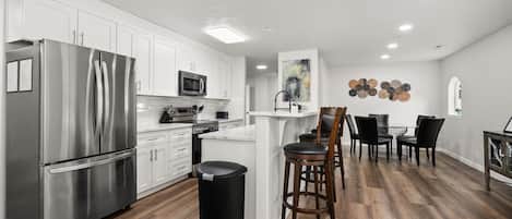Coffee/tea maker, fridge, microwave, oven