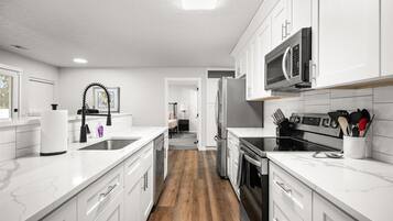 Coffee/tea maker, fridge, microwave, oven