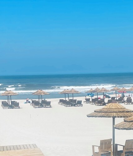 Beachfront apartment with terraces. 