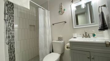 Shower, hair dryer, towels, soap