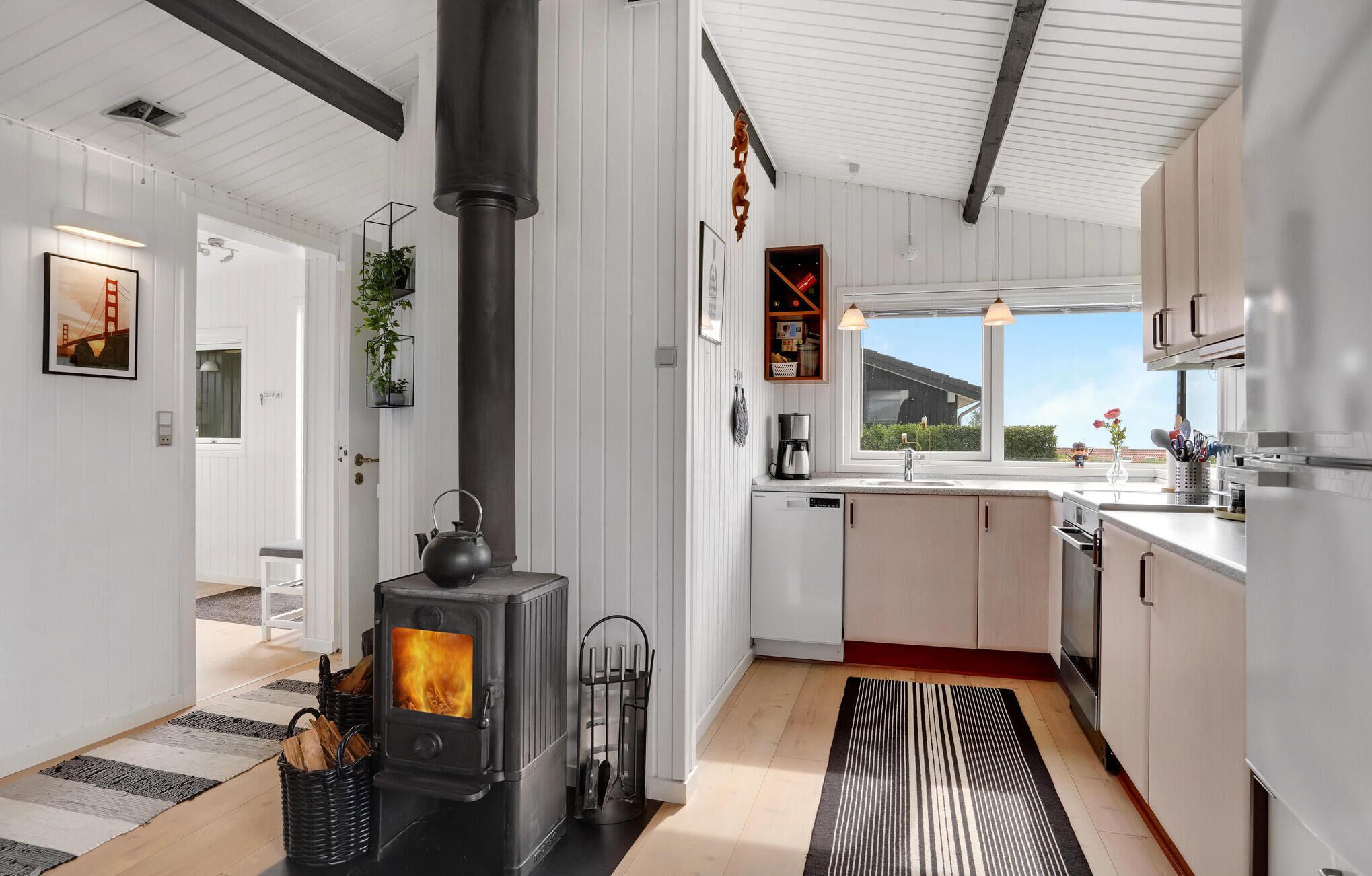 Fridge, stovetop, dishwasher, coffee/tea maker