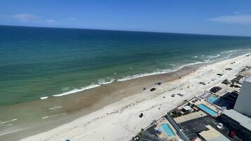 On the beach, sun loungers, beach towels