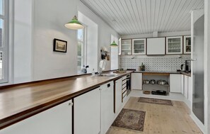 Fridge, dishwasher, coffee/tea maker, cookware/dishes/utensils