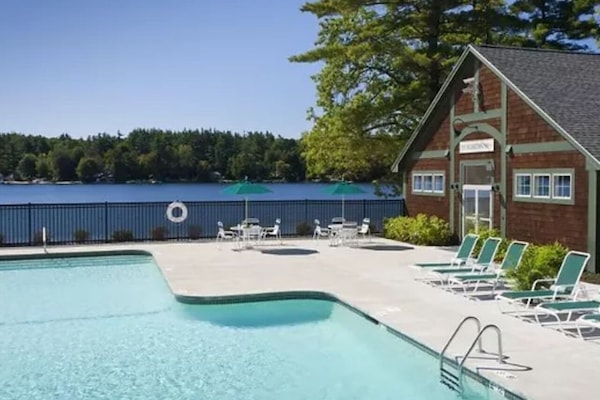 Heated pool next to gym, both overlooking the water.