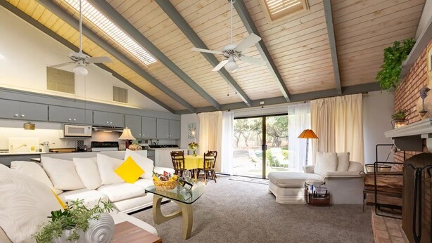 A modern living room with a sofa, coffee table, and dining area. - Secluded wine country retreat,  full kitchen (Arroyo Grande)