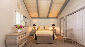 A bedroom with a bed, nightstands, a dresser, and a chair. - Secluded wine country retreat,  full kitchen (Arroyo Grande)