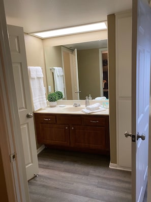 Bathtub, hair dryer, towels, soap