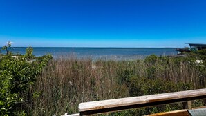 A wooden bench overlooking a body of water with a clear sky. - Unbelievable October Deals - Booking through 10/31/26 (Davis Park)