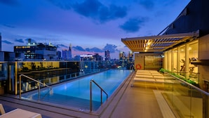 A rooftop pool with a city skyline view, glass railings, and a modern architectural design. - Sotetsu Grand Fresa Saigon (Ho Chi Minh City)