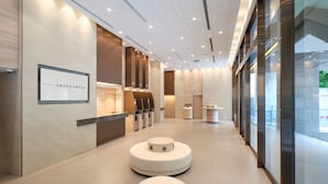 A modern hotel lobby with a reception desk, seating areas, and a sign reading "SOTETSU GRAND FRÉSA". - Sotetsu Grand Fresa Saigon (Ho Chi Minh City)