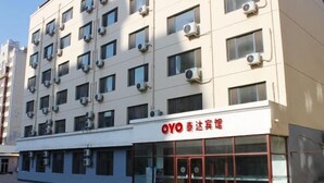 A multi-story building with air conditioning units on the exterior. - Taidawenquanbinguan (Yongqing)