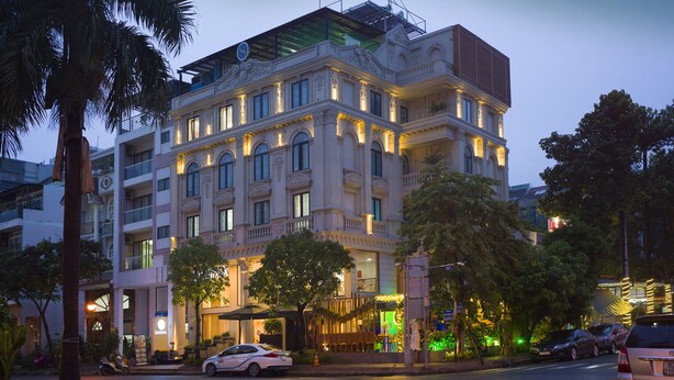 A multi-story hotel with a classic architectural design, featuring balconies and large windows. - Sabina Boutique Hotel 3 (Ho Chi Minh City)
