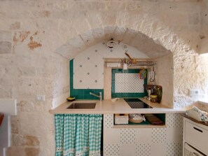 Microwave, stovetop, toaster, dining tables