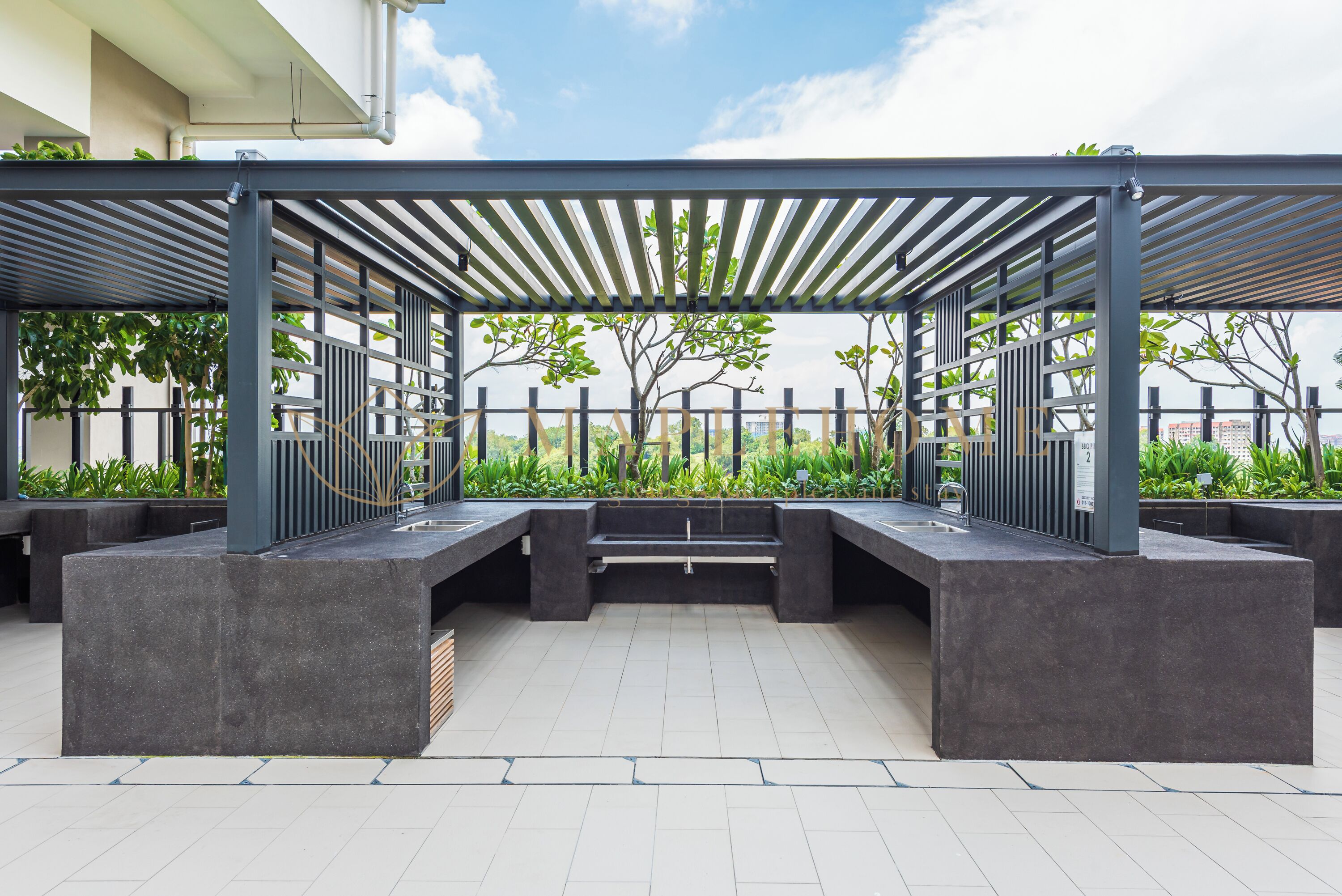 An outdoor seating area with a pergola, concrete planters, and a tiled floor.