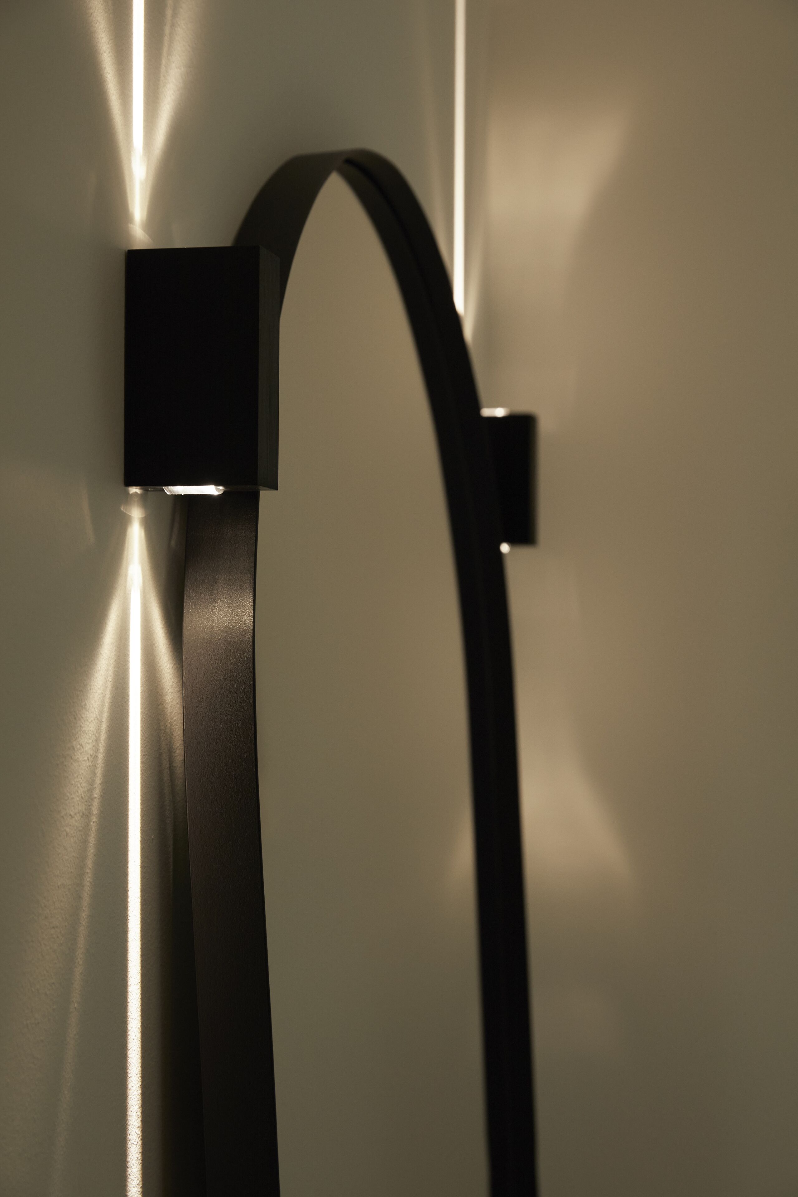 A wall-mounted light fixture with a sleek, modern design.