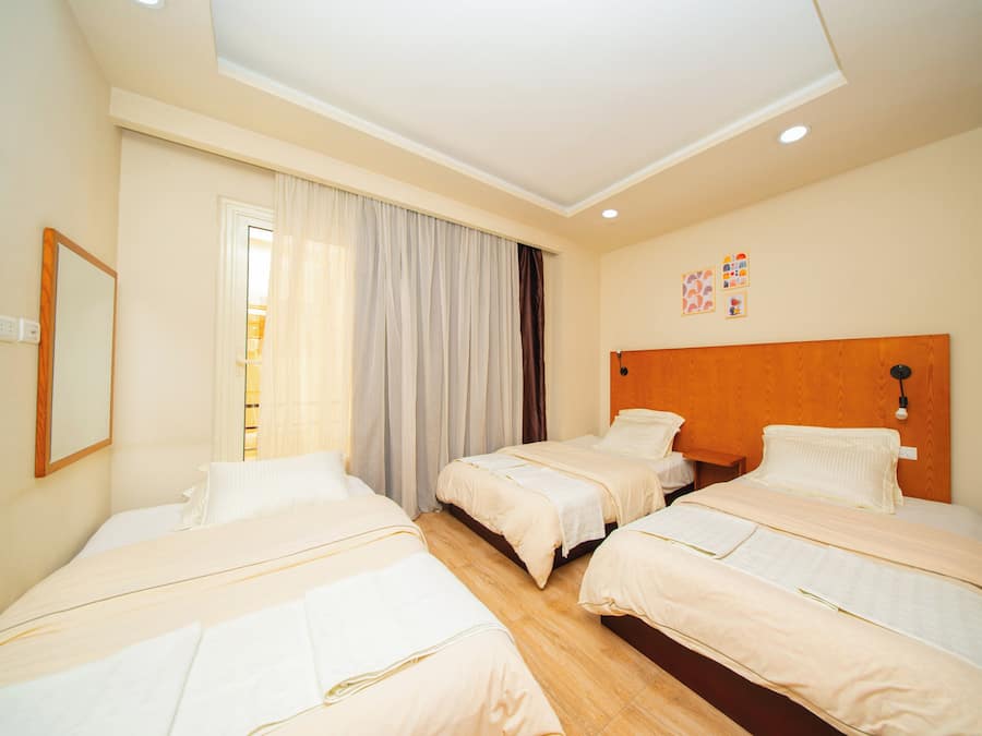 Economy Apartment, Multiple Beds | In-room safe, blackout curtains, iron/ironing board, free WiFi
