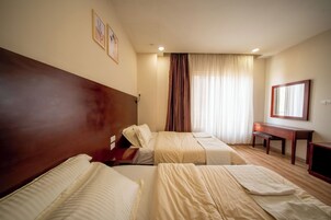 Standard Apartment, Multiple Beds | In-room safe, blackout drapes, iron/ironing board, free WiFi
