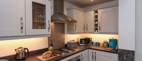 Fridge, electric kettle, toaster, cookware/dishes/utensils
