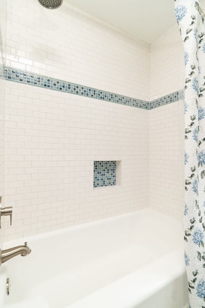 Bathtub, towels, toilet paper