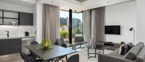 Business Apartment | Living area | 48-inch flat-screen TV with cable channels, TV, Netflix