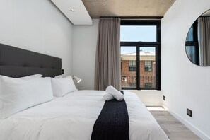 Apartamento empresarial | 2 quartos, cofres nos quartos, espaço de trabalho para notebook