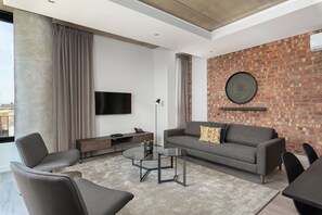 Apartamento empresarial | Área de estar | TV de tela plana 48 polegadas com canais a cabo, TV, Netflix