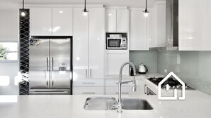A modern kitchen with stainless steel appliances, a built-in microwave, and a gas stove. - The Cosmopolitan *1 NIGHT FREE* Stay in the Heart of Sorrento (Sorrento)