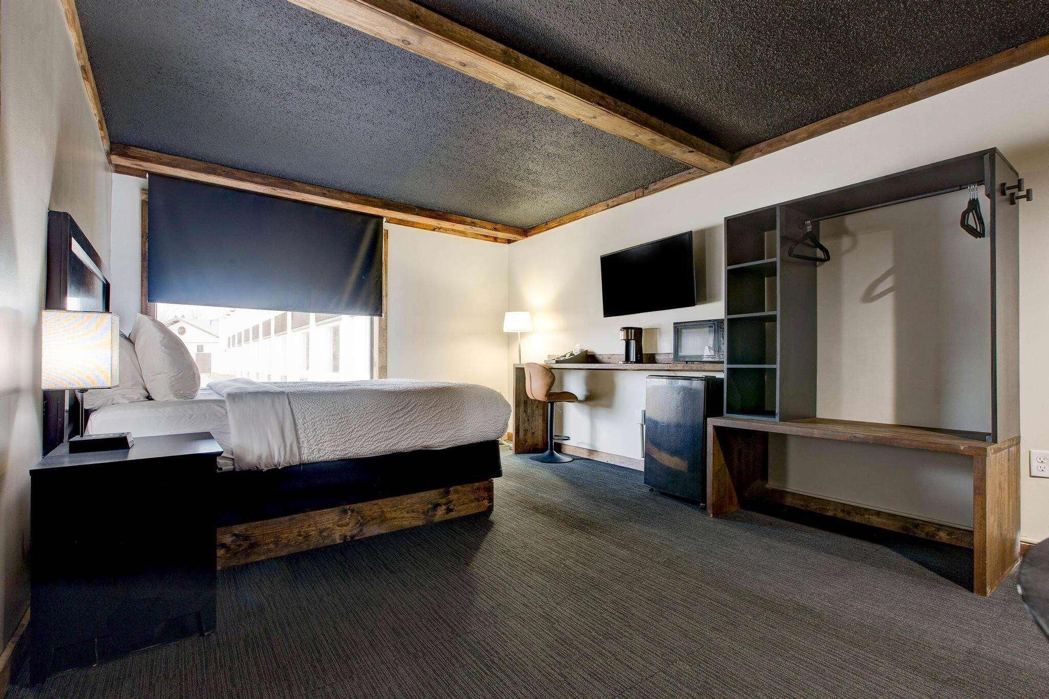 Premium bedding, desk, laptop workspace, blackout curtains