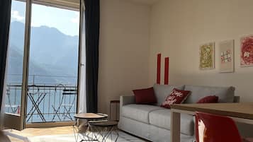 Family Apartment (04 - Giove) | Living area | 50-inch flat-screen TV with digital channels, TV