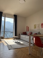 Family Apartment (04 - Giove) | Living area | 50-inch flat-screen TV with digital channels, TV