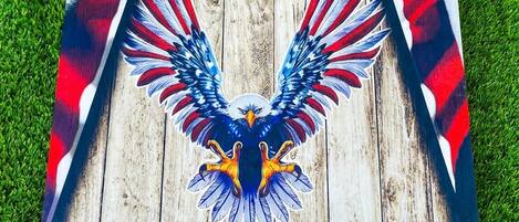 A wooden structure with an eagle design and American flag patterns.