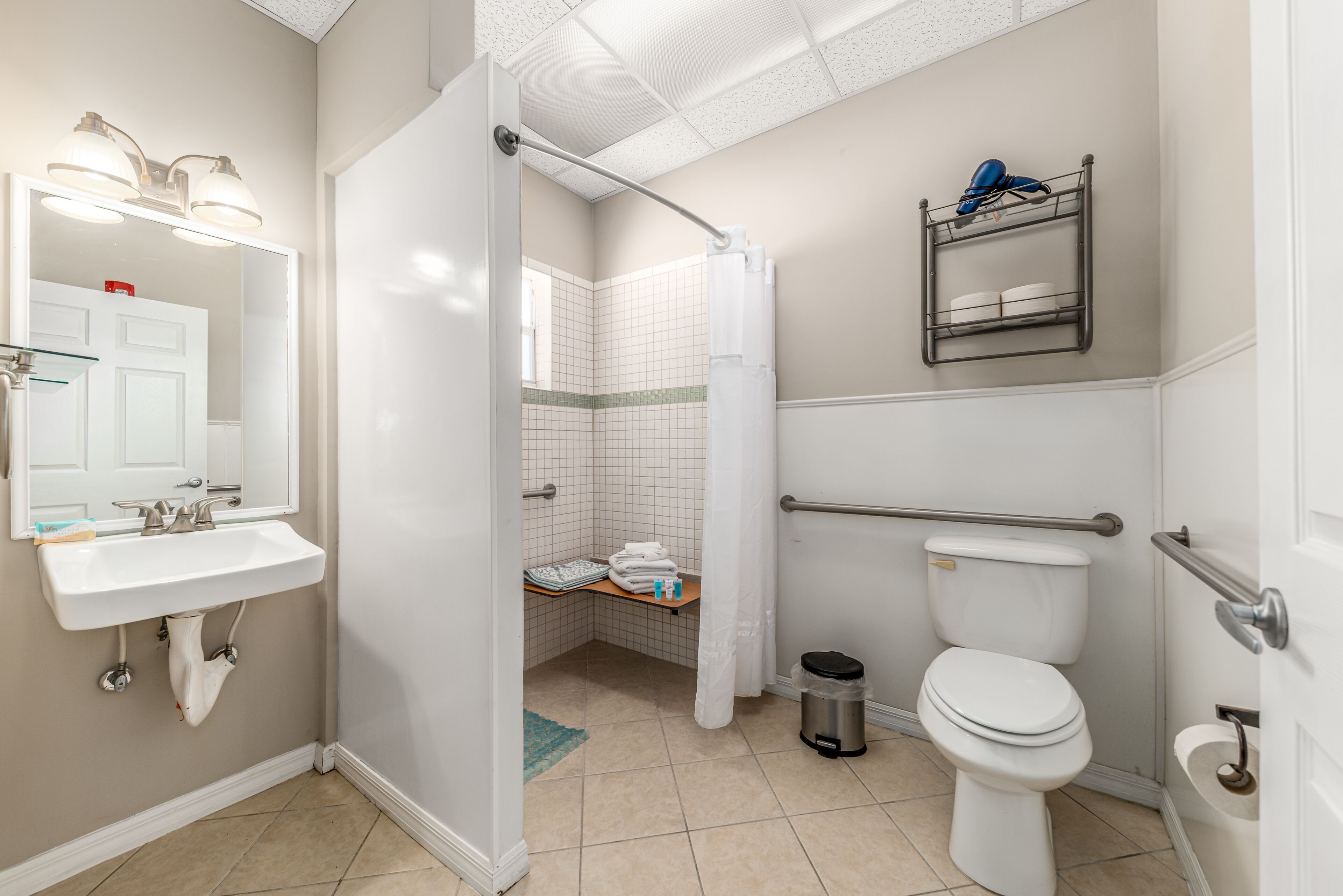 room 2, 1king bed, accessible | bathroom | free toiletries, hair dryer, towels, soap